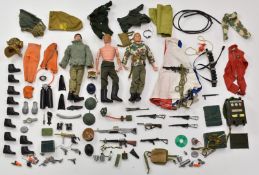 A collection of Action Man action figures, outfits and accessories.