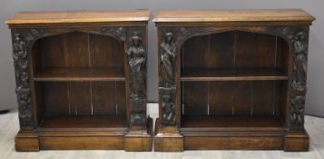 Near pair of Victorian figural carved oak breakfront bookcases, one W100 x D32 x H86cm, the second