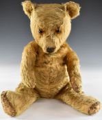 English Chad Valley or similar Teddy bear with blonde mohair, jointed limbs and stitched features,