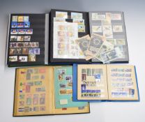 A selection of world stamps in four stockbooks, including USSR, Mongolia, Latvia etc