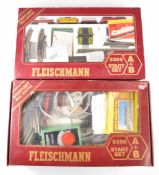 Two Fleischmann N gauge model railway 9396 sets, each including DB diesel locomotive and goods