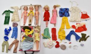 Six Sindy and Barbie dolls together with a collection of clothing, accessories and carry case.