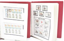 A collection of Isle of Man and Channel Islands stamps in nine Stanley Gibbons albums and six