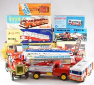 Seven friction or battery powered tinplate vehicles to include Alps Airport Bus, and QSH Fire Chief,