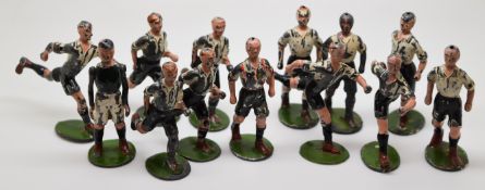 Thirteen Britains Famous Football Series lead model footballers comprising eleven players with black