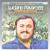 Pavarotti autographed record sleeve and LP, hand signed in black felt tip or similar pen, in perspex