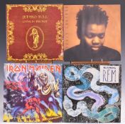 A collection of approximately 60 albums including Rush, Deep Purple, Led Zeppelin, Talk Talk, Dire