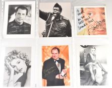 A collection of over 60 celebrity autographs to include John Travolta, Mary Quant, Hayley Mills, Ian
