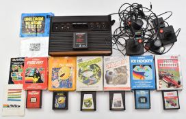 Atari 2600 Video Computer System together with controllers and seven games including Star Wars: