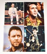 Four autographed 25 x 20cm film or movie prints signed by Tom Hanks, Russell Crowe, Robert Downey Jr