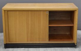 Two Gordon Russell of Broadway light oak tambour fronted cupboards, W120 x  D50 x H70cm