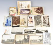 Approximately 200 all world postcards, photographs and items of ephemera including early