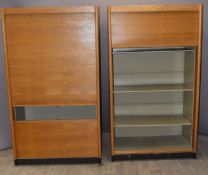 Two Gordon Russell of Broadway light oak tambour fronted cupboards, with metal linings for