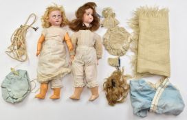 Two Armand Marseille bisque headed dolls comprising one with weighted blue eyes, open mouth,