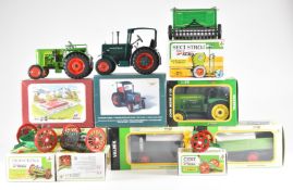 A collection of modern European tin plate farm vehicles all in original boxes.