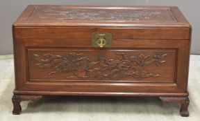 Chinese camphorwood chest with relief decoration of dragons and fitted interior, W91 x D46 x H51cm