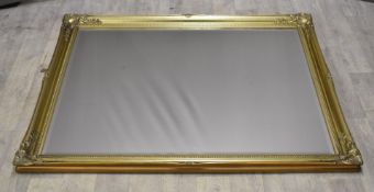 Gilt framed mirror with bevelled glass plate, overall size 103 x 132cm