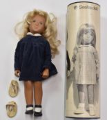 Sasha Trendon Ltd girl doll with blonde hair, painted blue eyes and pink lips, blue cord dress and