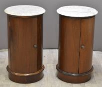Pair of mahogany circular cupboards with marble tops, height 73 x diameter 41cm