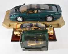 Three diecast model Jaguars comprising Corgi Classics Gold Plated Jaguar XK120 02903, Maisto Gold