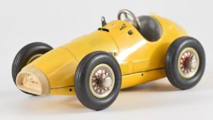 Schucco 1070 clockwork Grand Prix Racer with yellow body and grey interior.