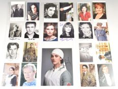 Twenty six 14 x 9cm signed postcards featuring the cast of Downton Abbey, autographs include Hugh