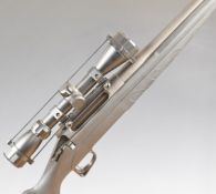 Remington 770 .243 bolt-action rifle with composite stock, textured semi-pistol grip and forend,