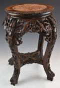 Chinese padauk wood jardinière stand with carved and pierced decoration of birds in foliage and