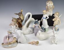 A collection of Lladro / Nao figures including Cupid, deer and fawn etc, tallest 21cm
