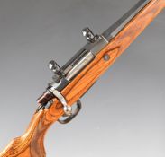 Potter & Walker .308 bolt-action rifle with laminated show wood stock, chequered semi-pistol grip