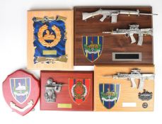 Five wall / desk plaques comprising four Gloucestershire Regiment and a similar Royal Engineers