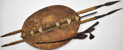 19th / 20thC leather / hide Zulu shield, spears, knobkerrie, axe and a bull's pizzle, longest 167cm