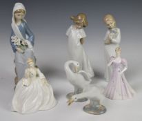 A collection of Lladro and Nao figures, tallest 24cm