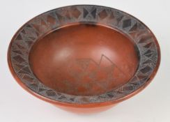Siddig El Nigoumi (1931-1996) incised earthenware studio pottery bowl with geometric border,
