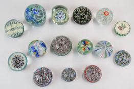 Fifteen Murano, Nason & Co and similar millefiori and other glass paperweights, one a faceted