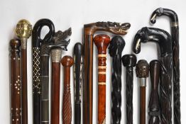 Fifteen walking sticks / canes including African tribal and Indian and Chinese interest with