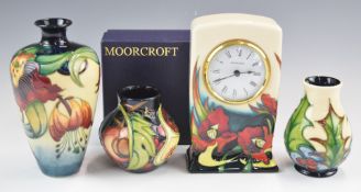 Three Moorcroft vases and a clock, tallest 16cm