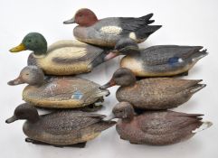 Seven Sportplast and similar plastic floating duck decoys.