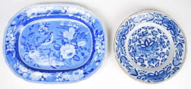 18thC Delft plate and a 19thC transfer decorated plate with bird decoration, largest 26 x 32cm