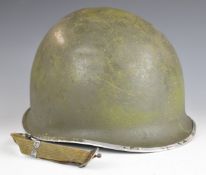 American steel helmet ink stamped to rim FO 16955870, with liner and chin strap