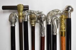 Nine walking sticks / canes including several by Roberto Cavagnini, others with mostly metal bird