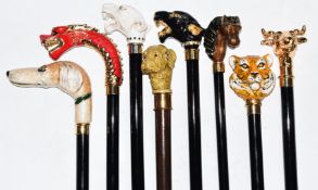 Eight walking sticks / canes with horse, dog and wild animal handles