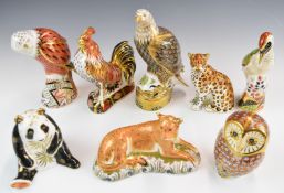 Eight Royal Crown Derby paperweights including birds of prey, panda, woodpecker, cockerel etc,