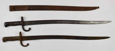 Two Yataghan bayonets, one with scabbard the other in relic condition, longest blade 57cm. PLEASE