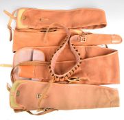 Four Brady of Halesowen canvas and leather shotgun slips and a leather cartridge belt.