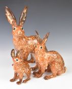 Three Winstanley Pottery hares, number 2, 5 and 9, tallest 37cm