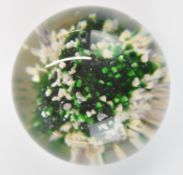 Baccarat glass paperweight with rock or sand dune decoration and paper label to base, 45mm in