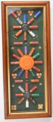 Shotgun cartridge and clay display board or case, framed and glazed, 38 x 82cm. We are not able to
