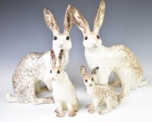 Winstanley Pottery opposing pair of number 9 hares together with a 2 and 3, tallest 37cm