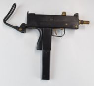 ASG Cobray Ingram M11 Uzi sub machine gun style airsoft pistol with folding stock and extended